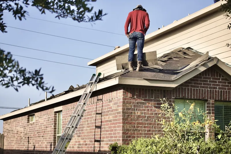 Professional roofer working on a residential roof in Outdoor Resorts of America